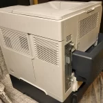 HP LaserJet p4014n Printer side view two HP LaserJet p4014n Printer side view two